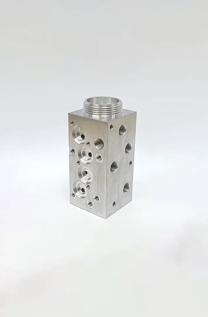 Manifold block precision machined by custom component manufacturer for OEM clients